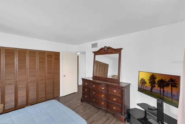 a bedroom with a bed and furniture