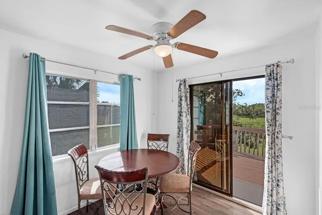 a dining room with furniture and window