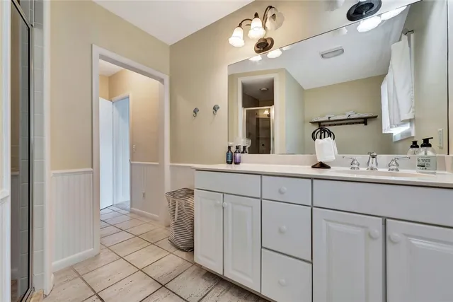 a bathroom with a sink and mirror