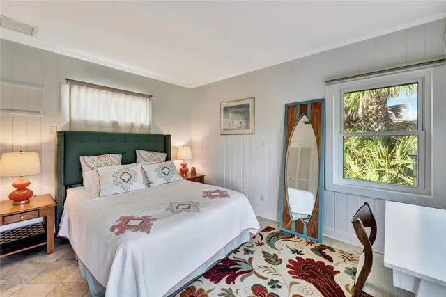 a bedroom with furniture and a book shelf