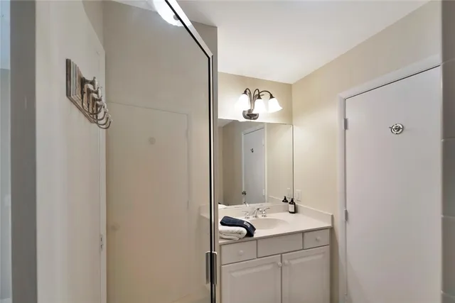 a view of a patio with a table chairs and wooden floor