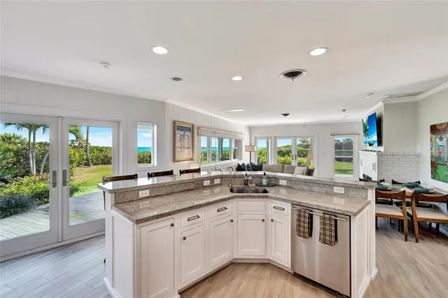 a bed sitting in a room next to a window