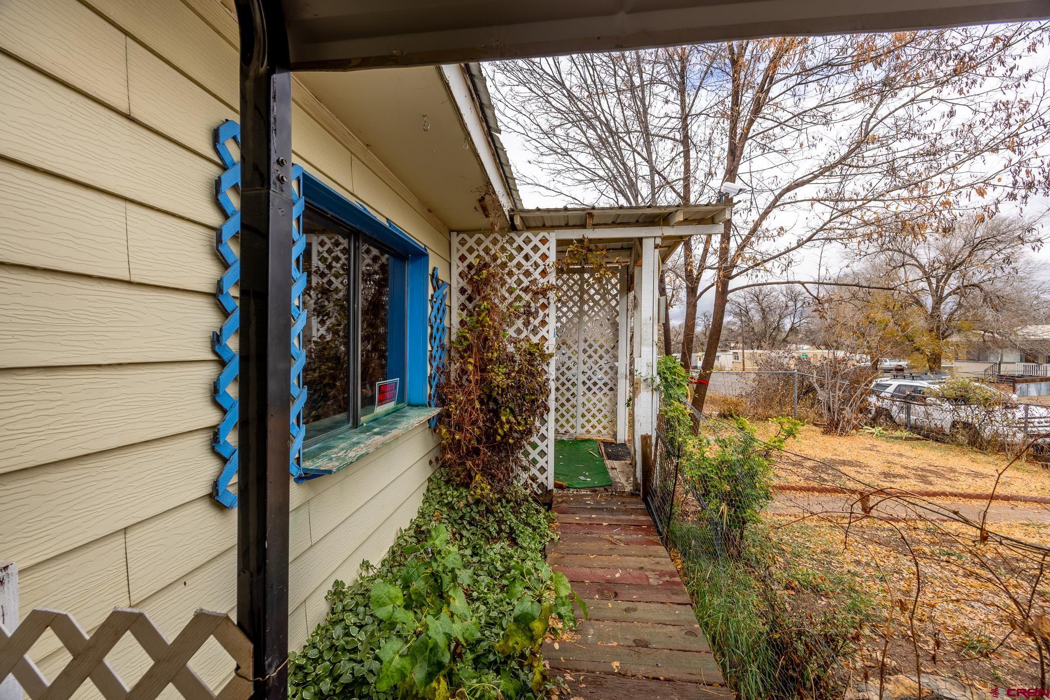 537 North Elm Street Cortez, CO 81321 - Photo 11 of 41 a view of a pathway of a house with an outdoor space