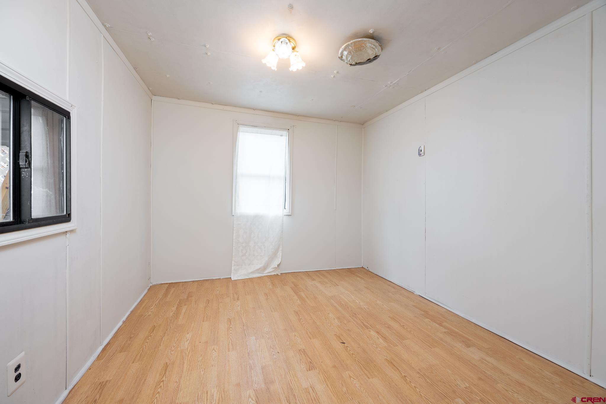 537 North Elm Street Cortez, CO 81321 - Photo 23 of 41 a view of empty room with window