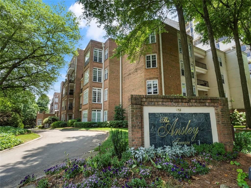 175 15th Street Northeast, Unit 412 Atlanta, GA 30361 - Photo 1 of 1 front view of a house with a garden