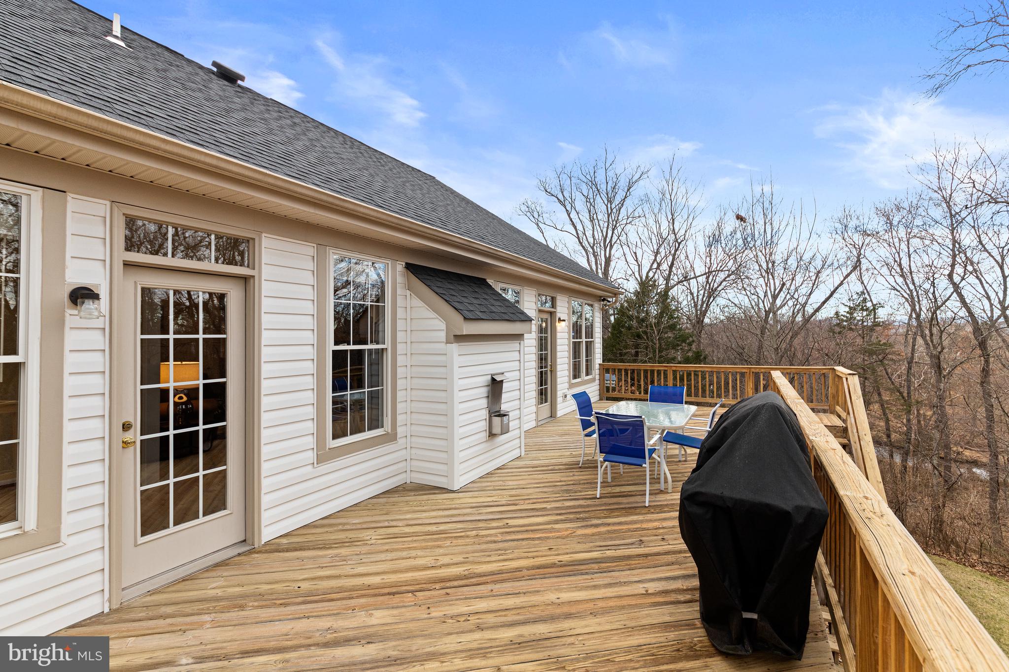 13558 Ryton Ridge Lane Gainesville, VA 20155 - Photo 32 of 63 The sunroom and kitchen lead to the spacious deck.