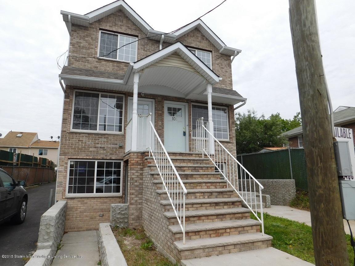 104 Willowbrook Road Staten Island, NY 10302 - Photo 2 of 16 a front view of a house with a yard