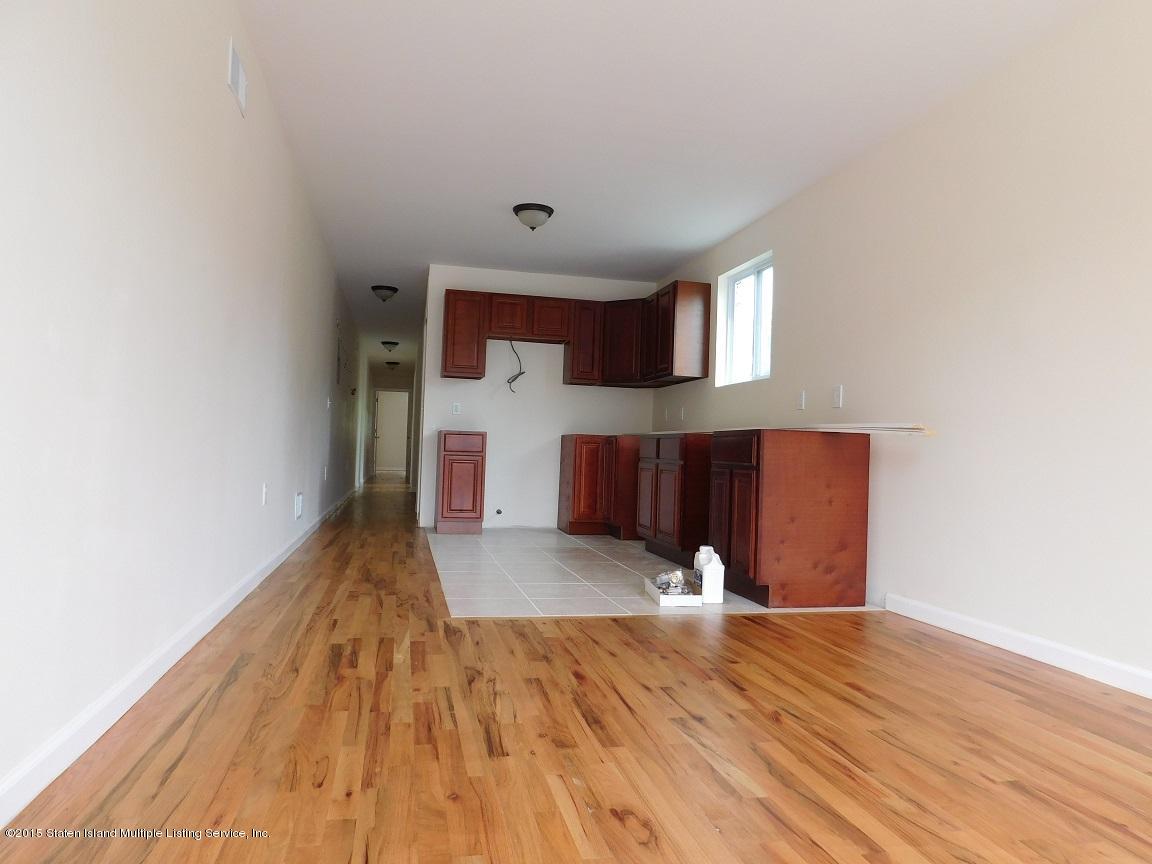 104 Willowbrook Road Staten Island, NY 10302 - Photo 7 of 16 a view of a living room with wooden floor