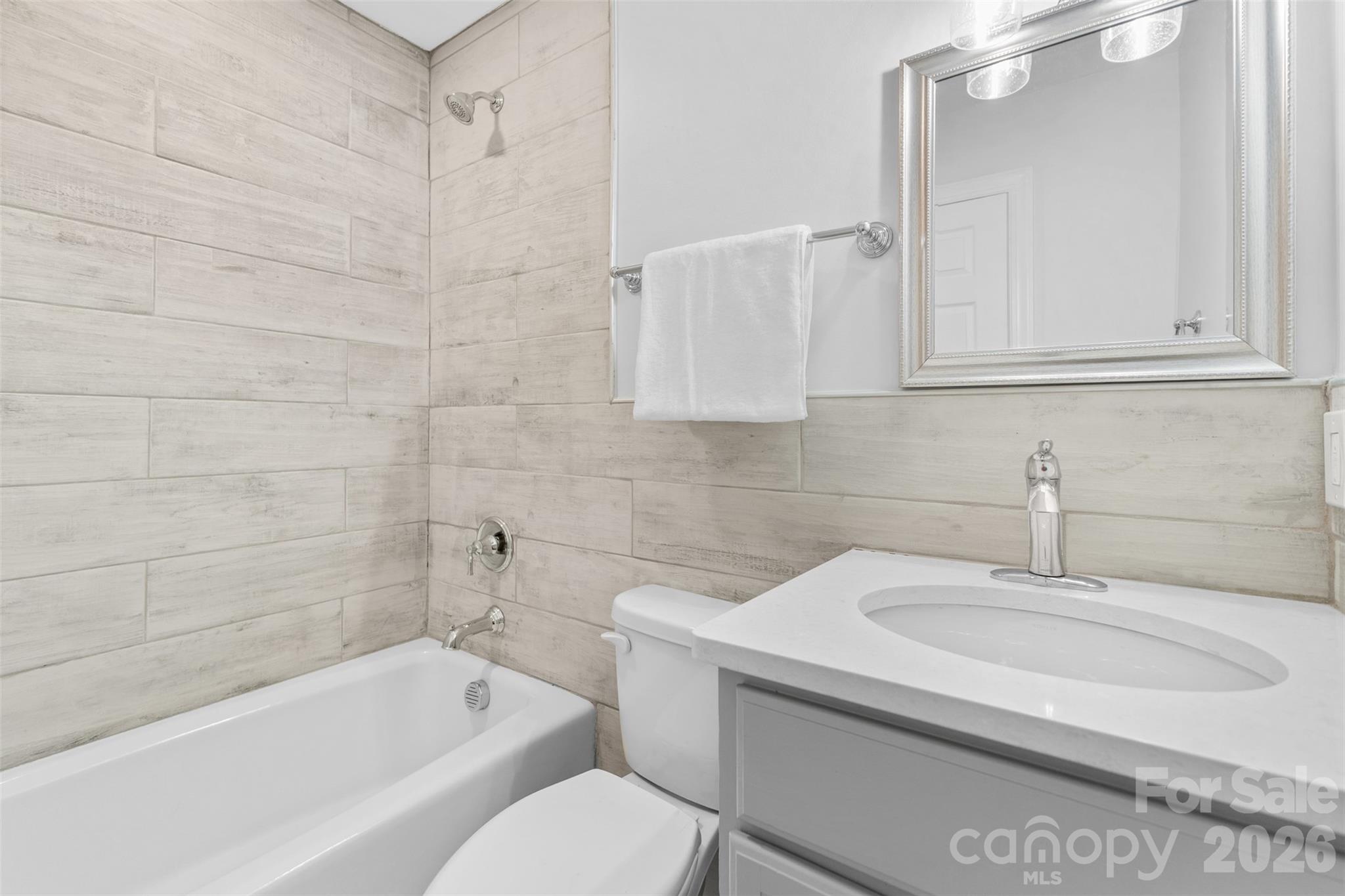 206 Hunter Street York, SC 29745 - Photo 15 of 20 a bathroom with a sink toilet and bathtub