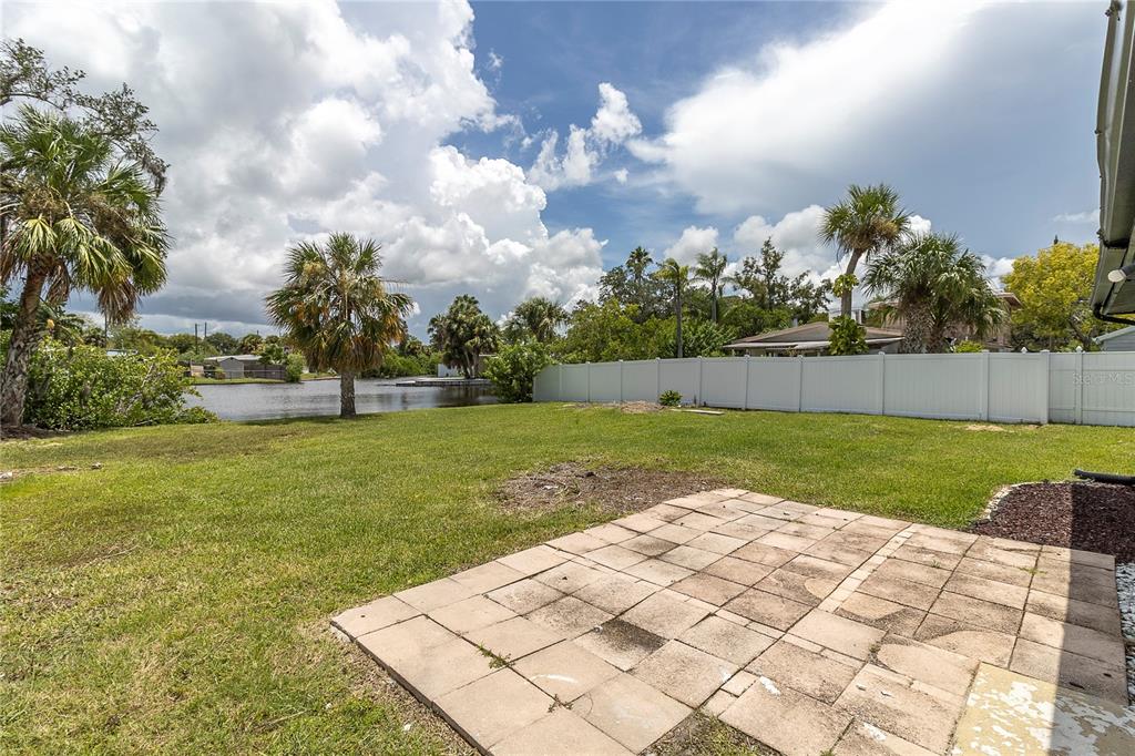 7320 Oelsner Street New Port Richey, FL 34652 - Photo 24 of 29 a view of yard with swimming pool and green space