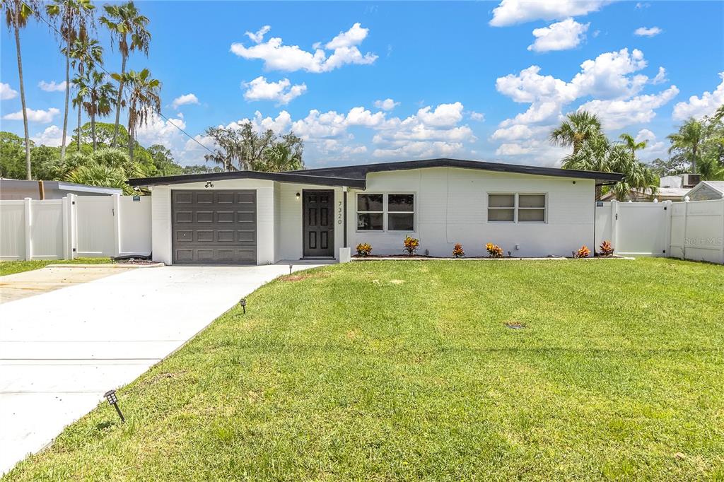 7320 Oelsner Street New Port Richey, FL 34652 - Photo 28 of 29 a house view with a garden space