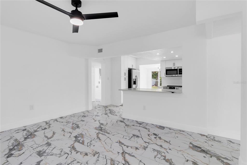7320 Oelsner Street New Port Richey, FL 34652 - Photo 6 of 29 a view of kitchen and utility room