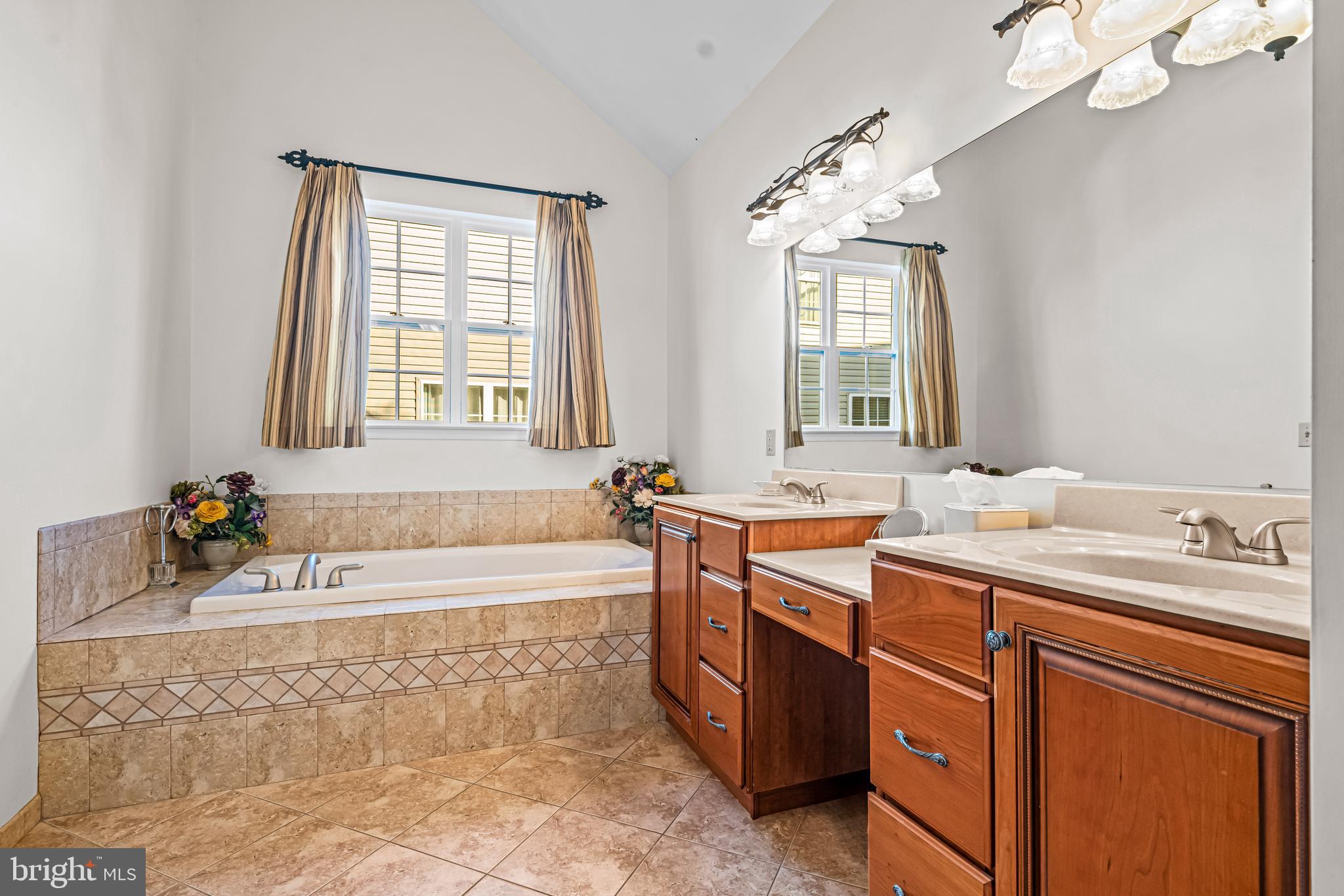 1200 Creekside Lane Quakertown, PA 18951 - Photo 21 of 37 a bathroom with a tub sink and mirror