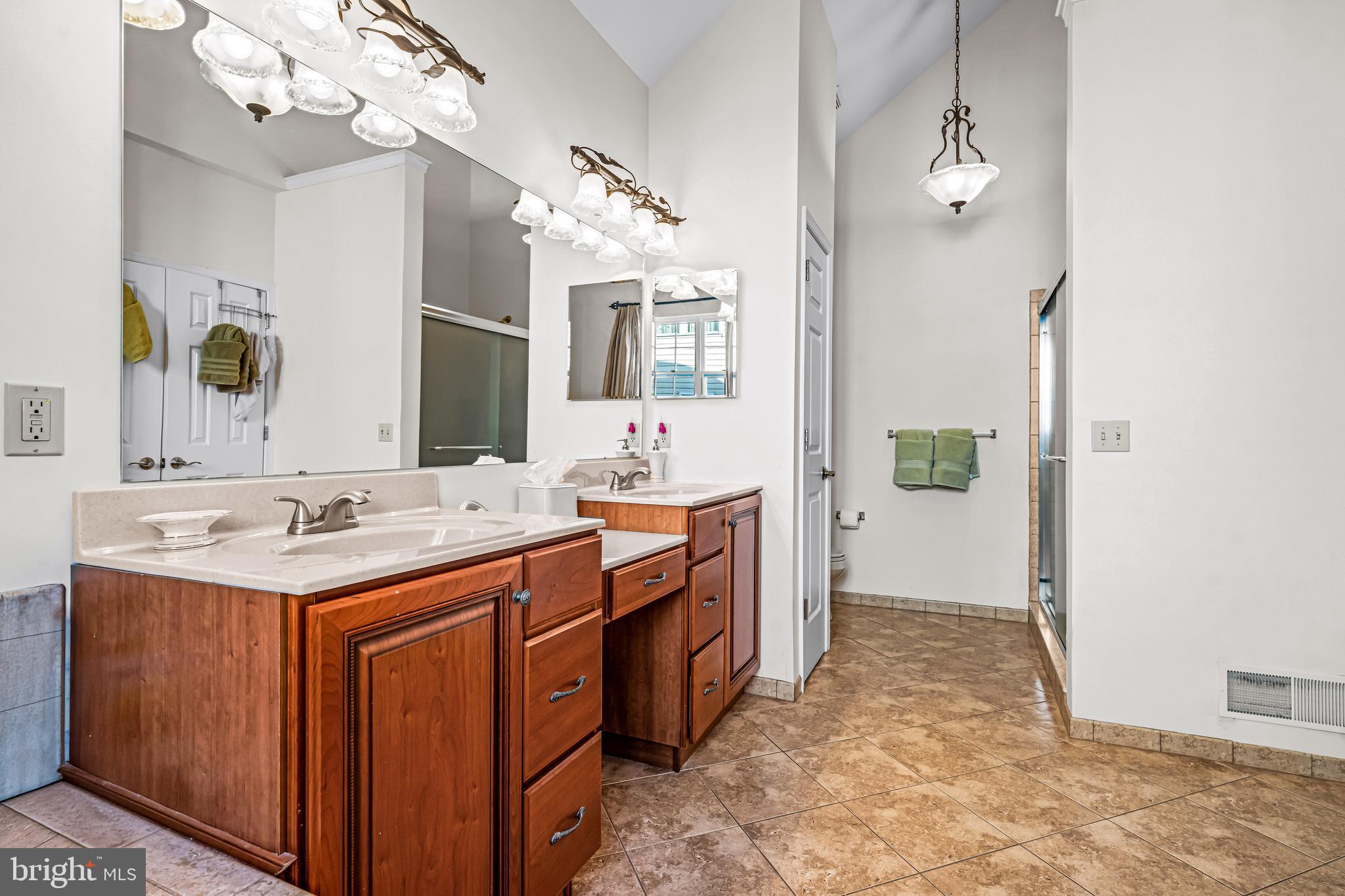 1200 Creekside Lane Quakertown, PA 18951 - Photo 22 of 37 a bathroom with a sink vanity and a mirror
