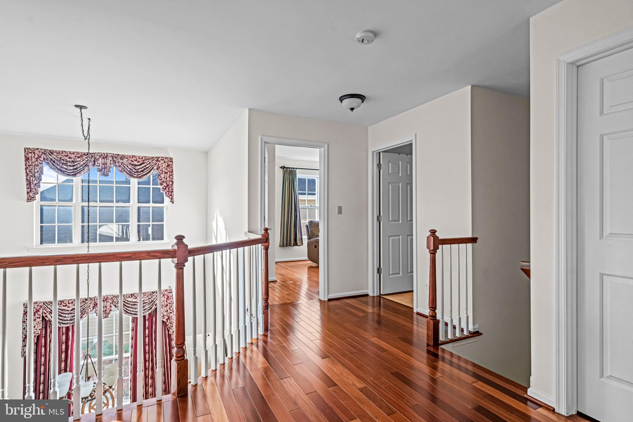 1200 Creekside Lane Quakertown, PA 18951 - Photo 26 of 37 a view of a hallway with wooden floor and windows