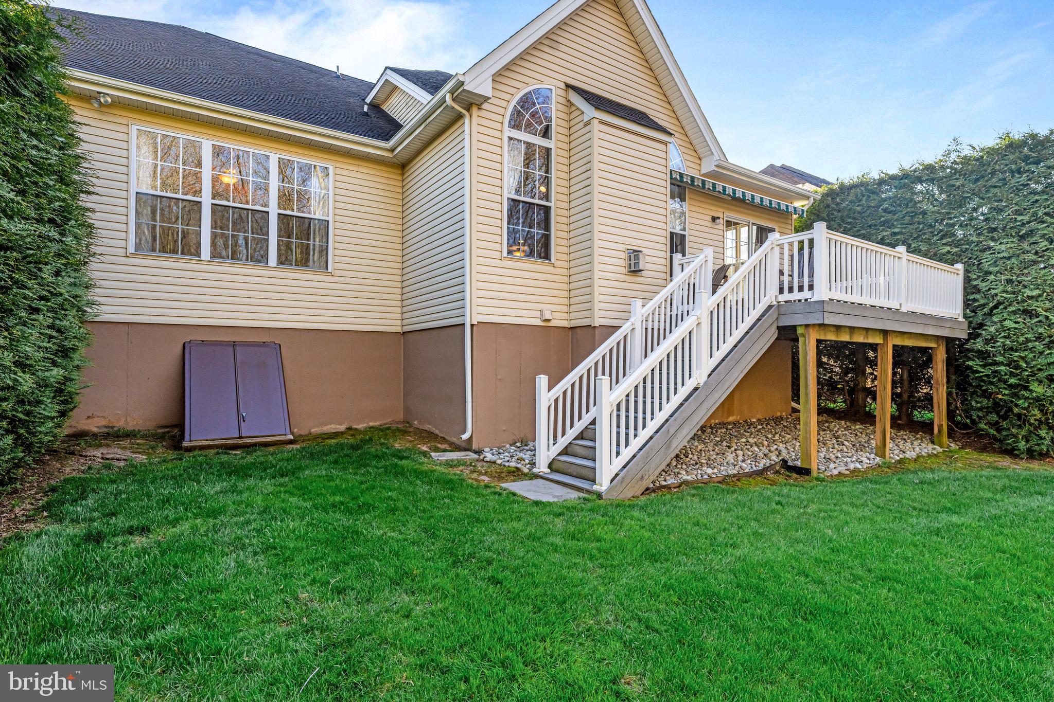 1200 Creekside Lane Quakertown, PA 18951 - Photo 31 of 37 a view of a house with a yard and deck