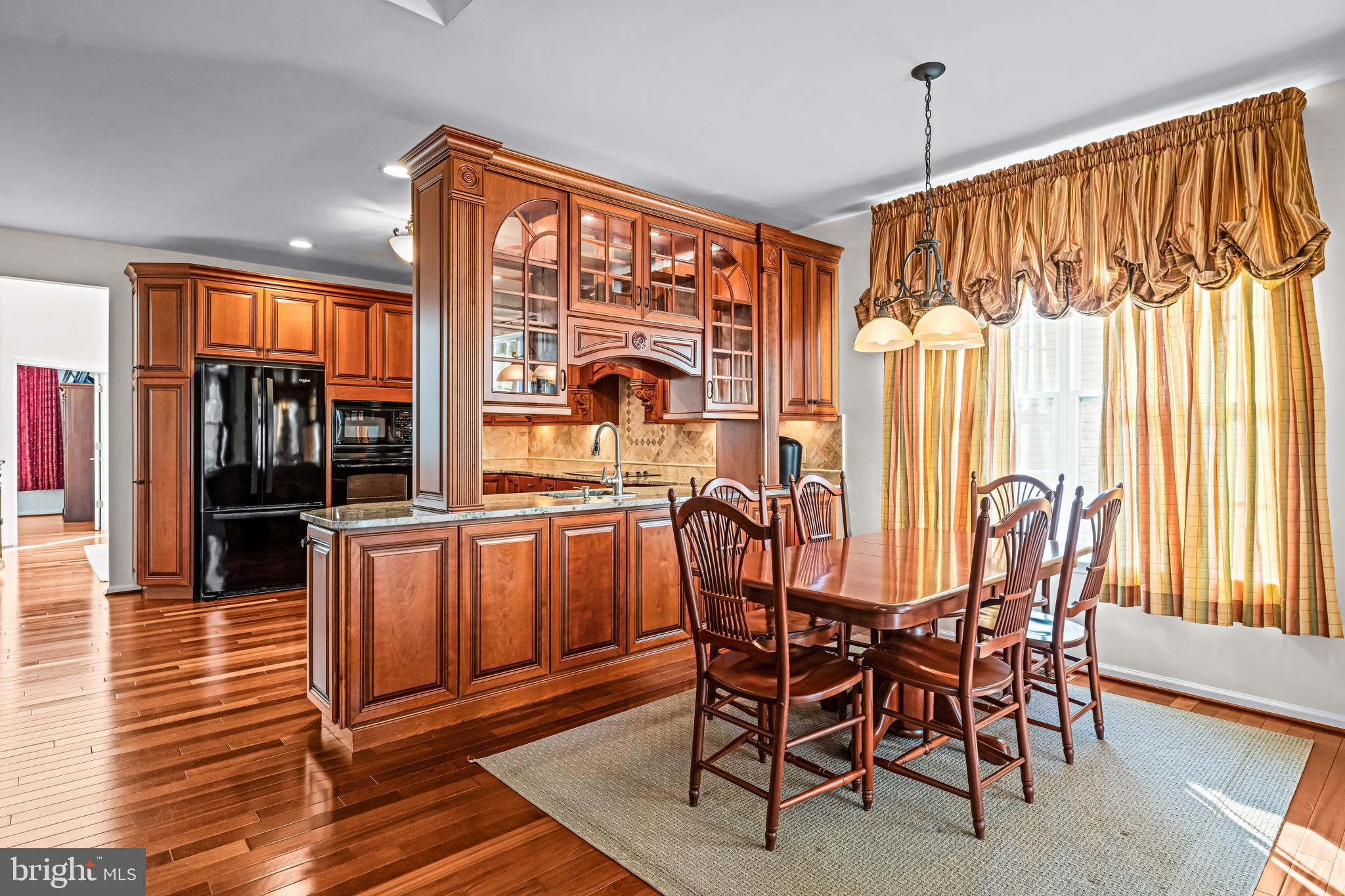 1200 Creekside Lane Quakertown, PA 18951 - Photo 8 of 37 a view of a dining room with furniture window and wooden floor