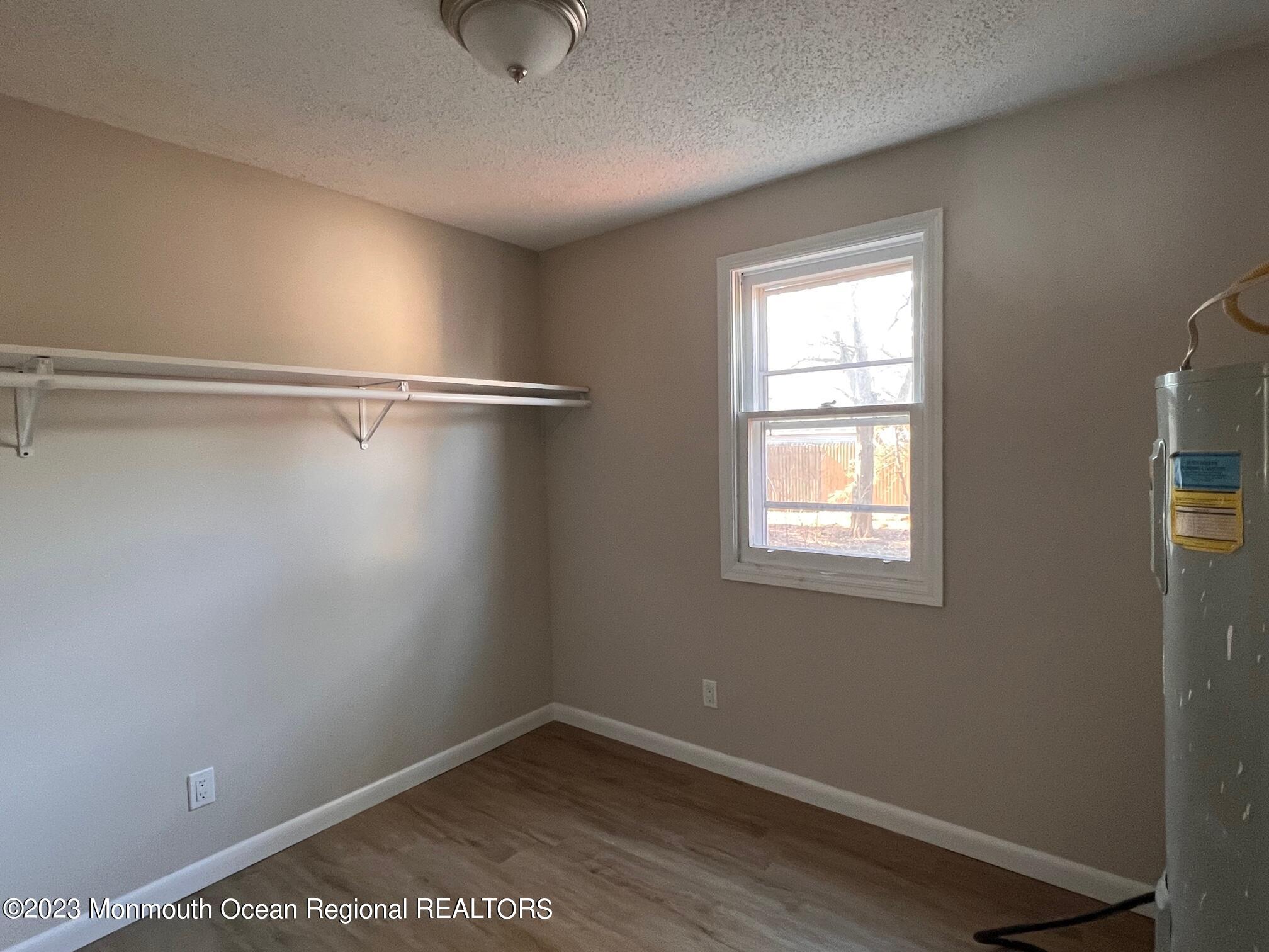 16 Walnut Street Waretown, NJ 08758 - Photo 9 of 12 a view of a room that has a window in it