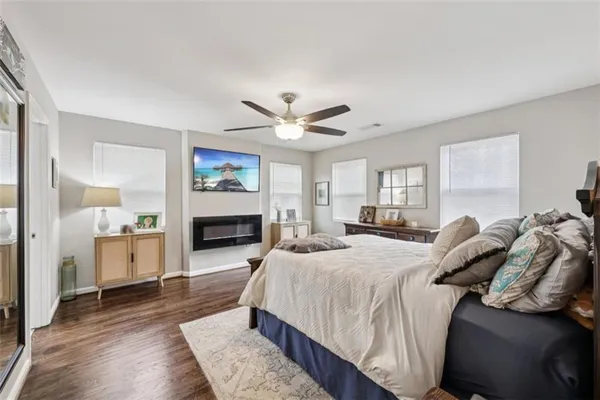 a bedroom with a bed and a table in it