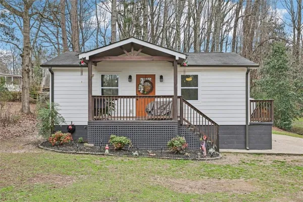 a front view of a house with a yard