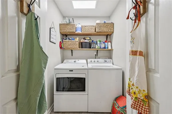 a bathroom with a toilet a sink and a mirror