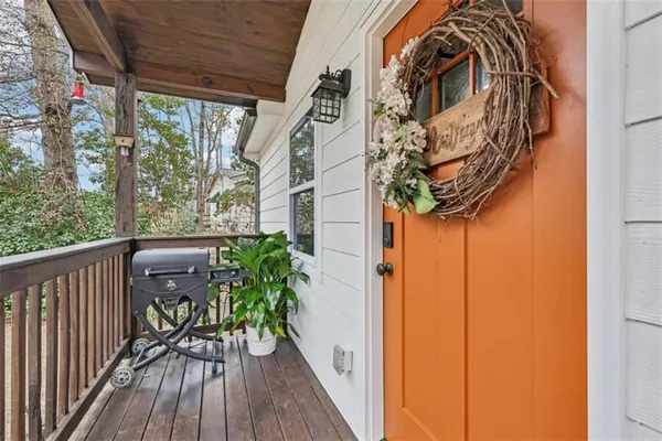 a view of balcony with wooden floor and bench