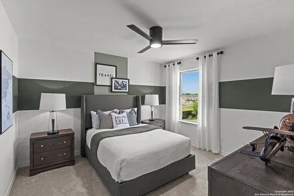a bedroom with a bed and window