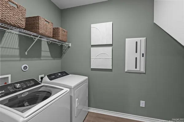 a utility room with dryer and washer