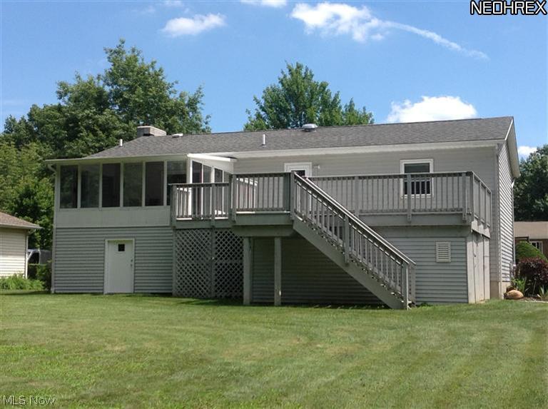 Huge deck, super sunroom, and tons of storage for mower, motorcycles, toys, patio furniture and more.