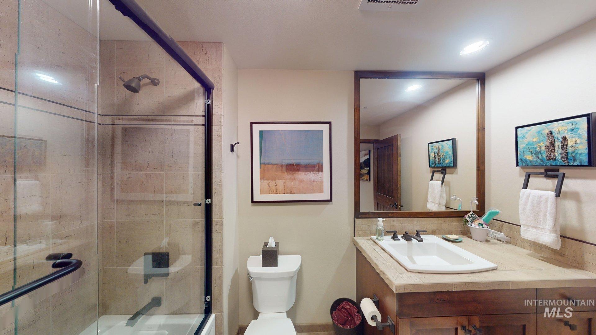 616 North 3rd Street, Unit 211 McCall, ID 83638 - Photo 39 of 49 Bathroom with a tile shower and vanity