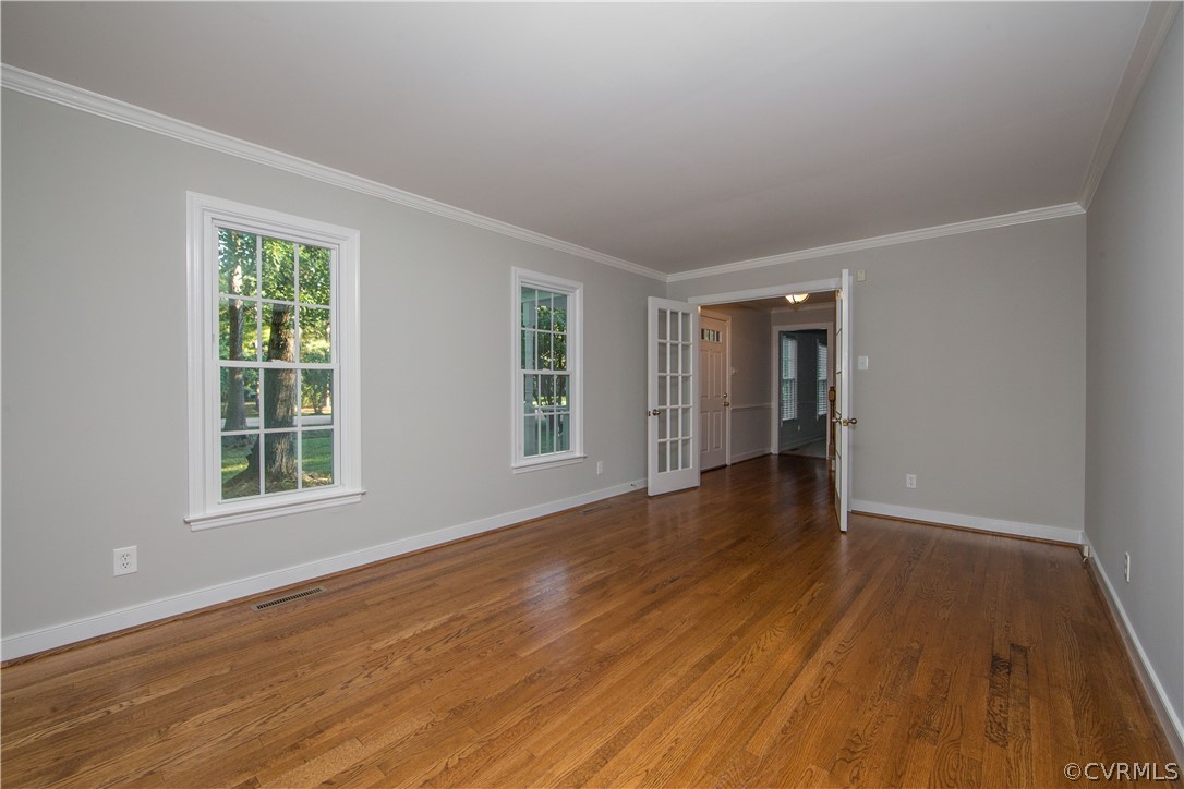 14200 Chepstow Road Midlothian, VA 23113 - Photo 15 of 41 a view of an empty room with wooden floor and a window