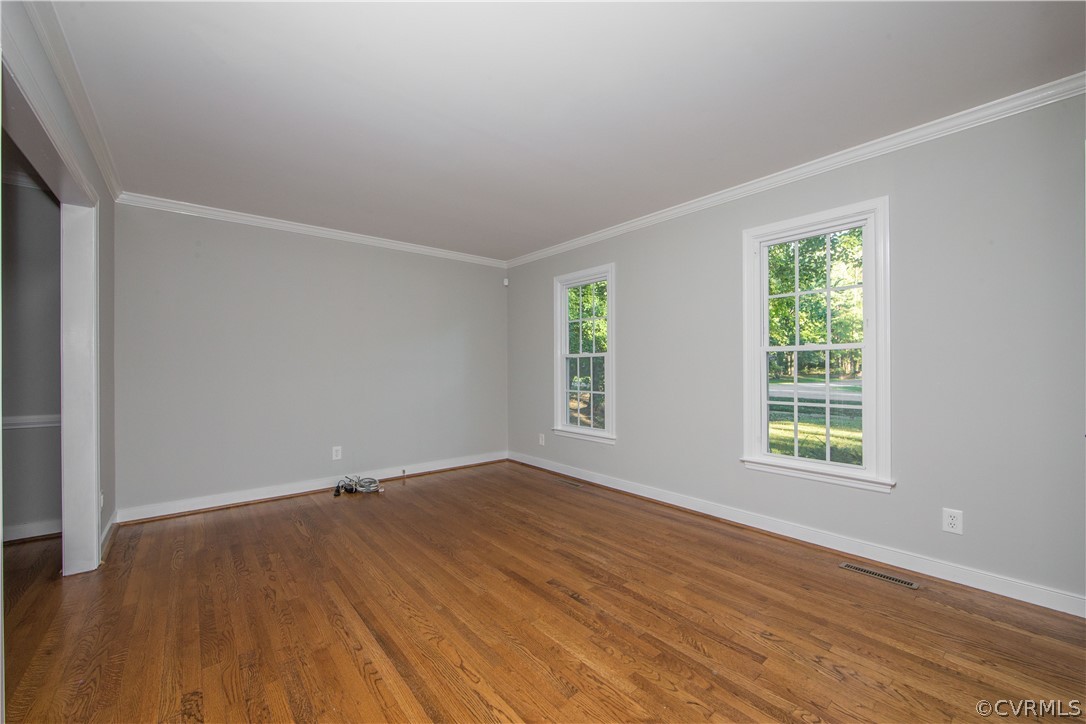 14200 Chepstow Road Midlothian, VA 23113 - Photo 17 of 41 an empty room with wooden floor and windows