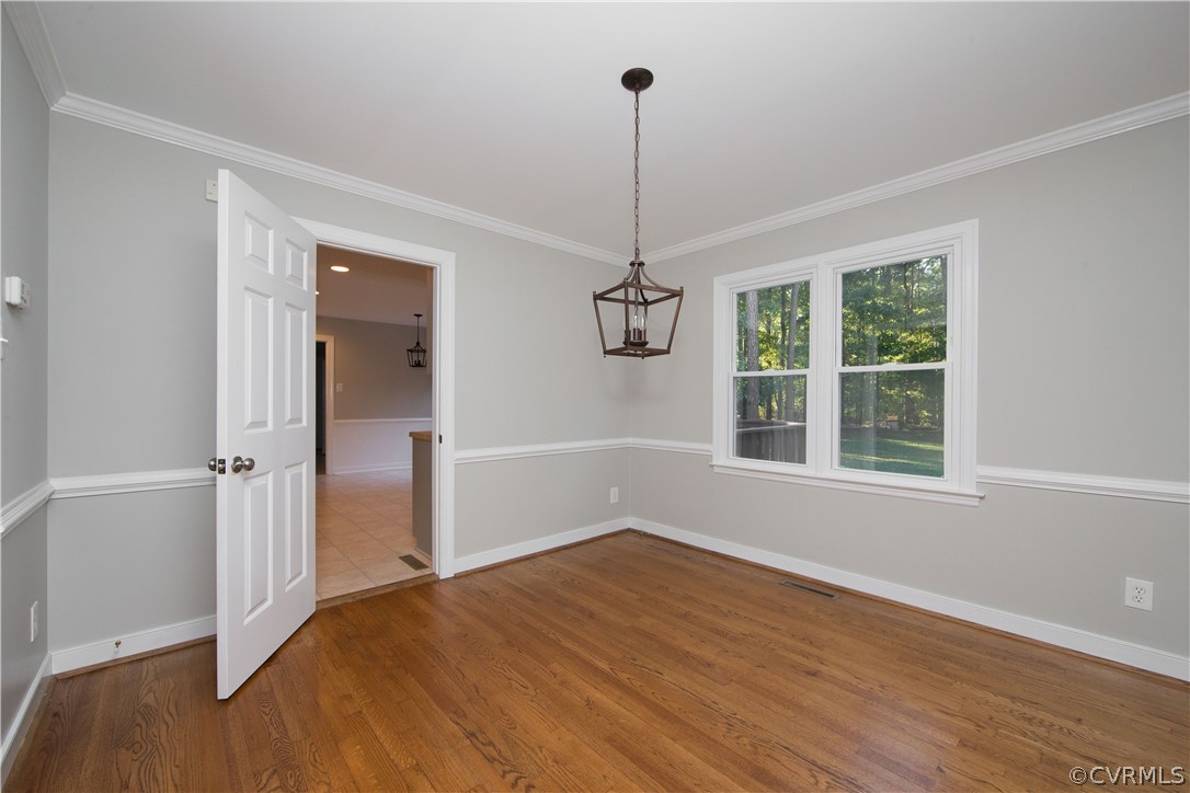 14200 Chepstow Road Midlothian, VA 23113 - Photo 18 of 41 a view of empty room with wooden floor ceiling fan and window