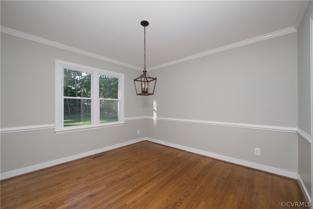 14200 Chepstow Road Midlothian, VA 23113 - Photo 19 of 41 a view of a room with wooden floor exposed radiator and a window