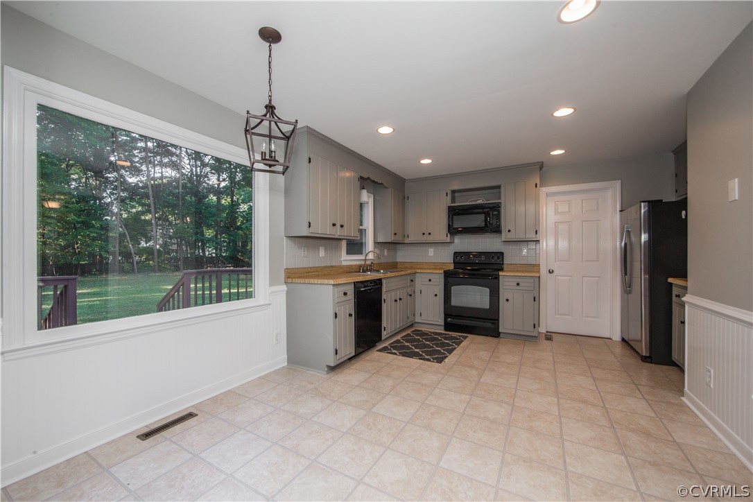 14200 Chepstow Road Midlothian, VA 23113 - Photo 20 of 41 a kitchen with a refrigerator a sink and cabinets