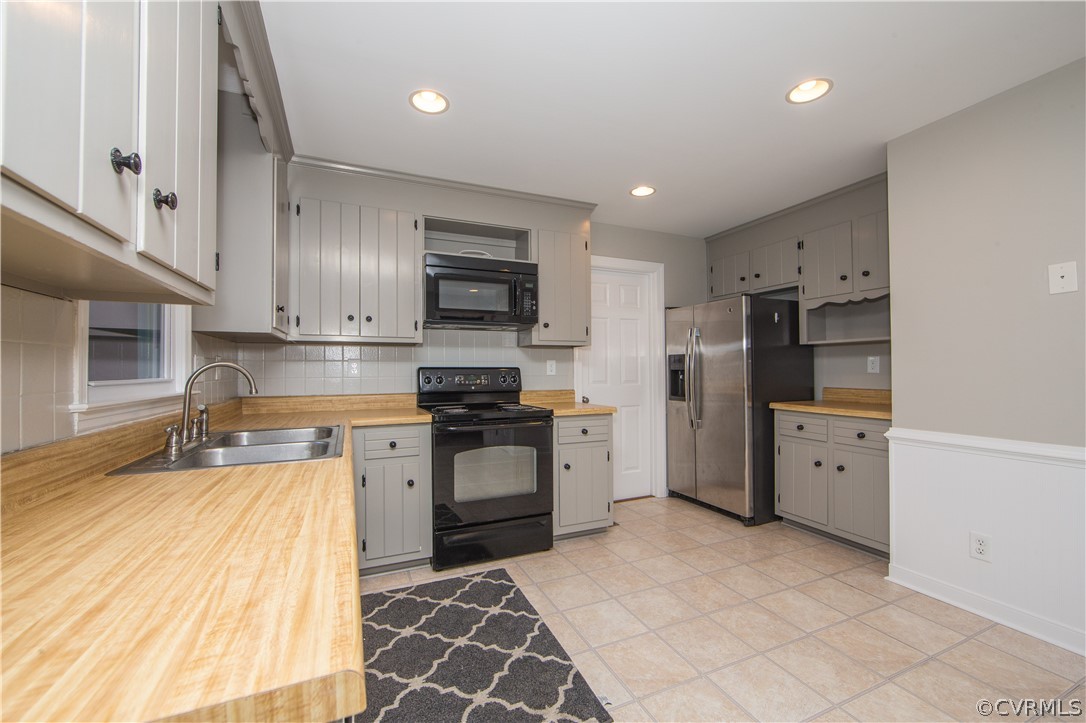 14200 Chepstow Road Midlothian, VA 23113 - Photo 22 of 41 a kitchen with stainless steel appliances granite countertop a refrigerator sink and stove