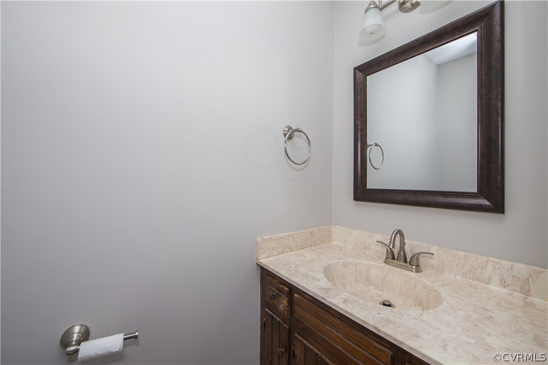 14200 Chepstow Road Midlothian, VA 23113 - Photo 24 of 41 a bathroom with a sink and mirror