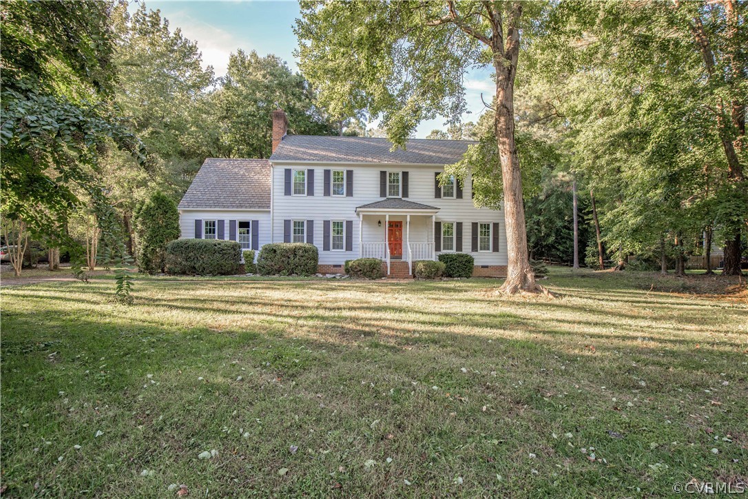 14200 Chepstow Road Midlothian, VA 23113 - Photo 3 of 41 a front view of a house with a yard table and chairs