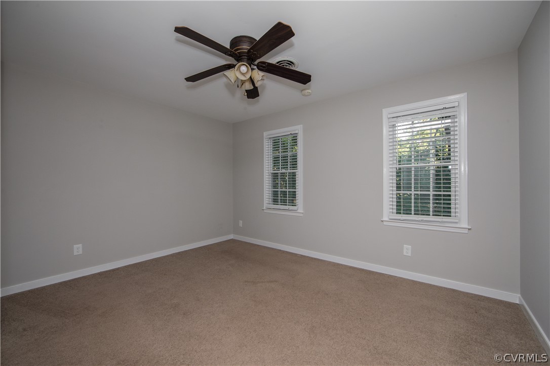 14200 Chepstow Road Midlothian, VA 23113 - Photo 35 of 41 an empty room with a window and a fan