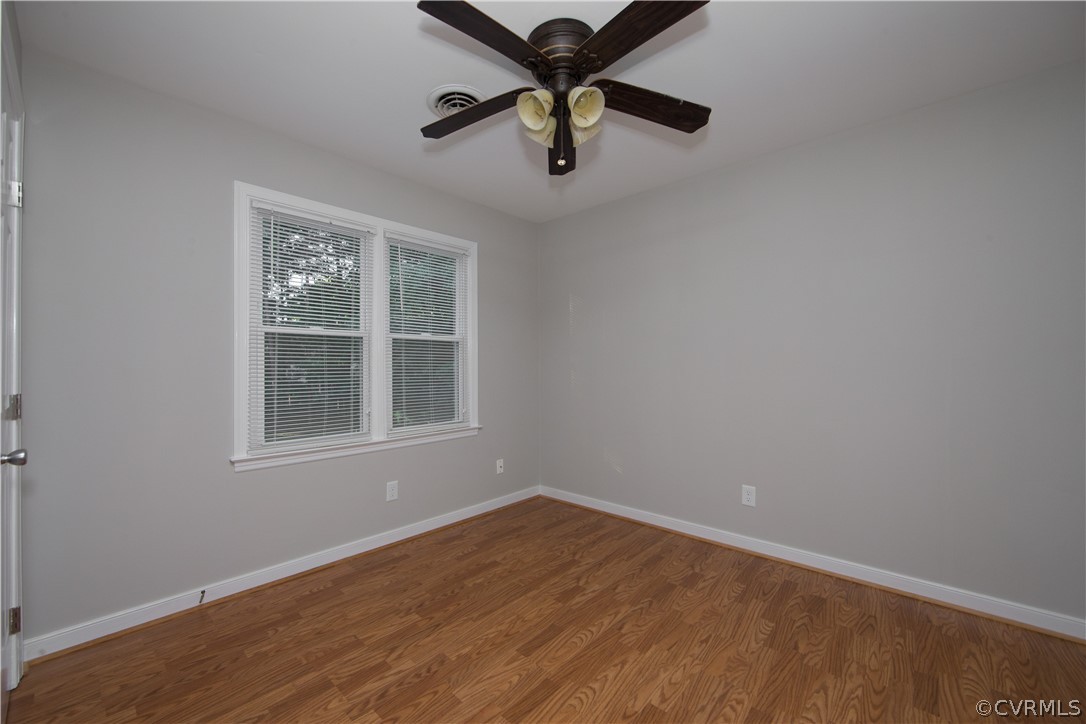 14200 Chepstow Road Midlothian, VA 23113 - Photo 37 of 41 an empty room with a window and a ceiling fan