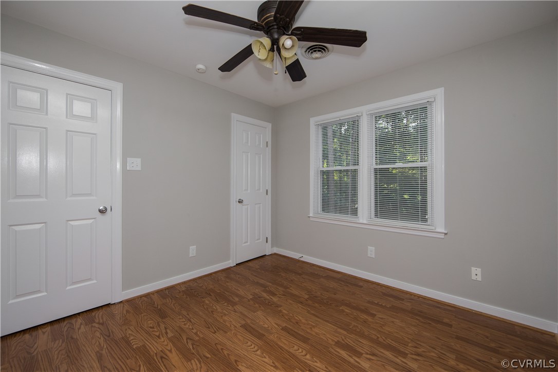 14200 Chepstow Road Midlothian, VA 23113 - Photo 38 of 41 a view of an empty room with window and wooden floor