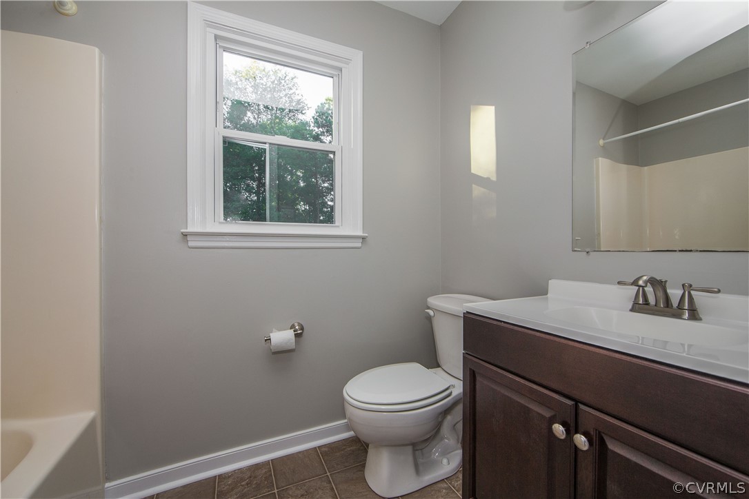 14200 Chepstow Road Midlothian, VA 23113 - Photo 39 of 41 a bathroom with a toilet a sink and a window