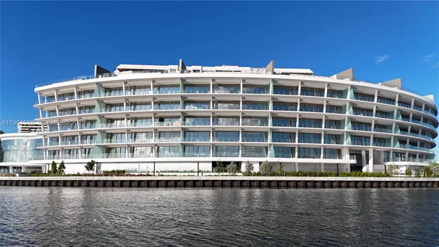 a front view of a building with a lake view