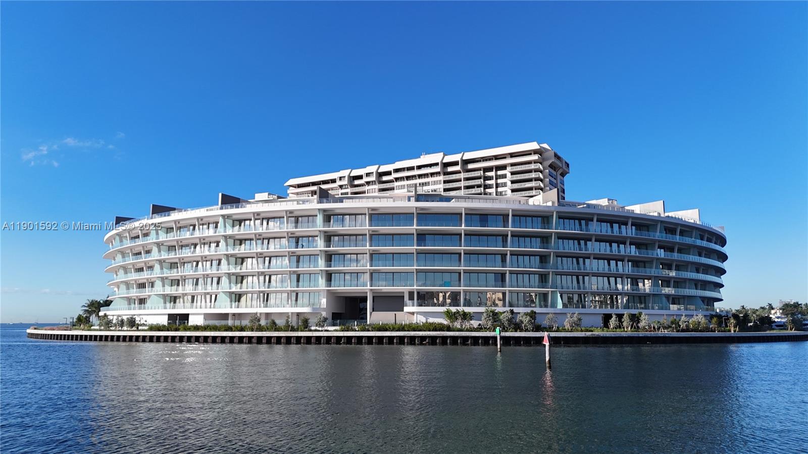 5 Grove Isle Drive, Unit S502 Coconut Grove, FL 33133 - Photo 19 of 19 a front view of a building with lake view