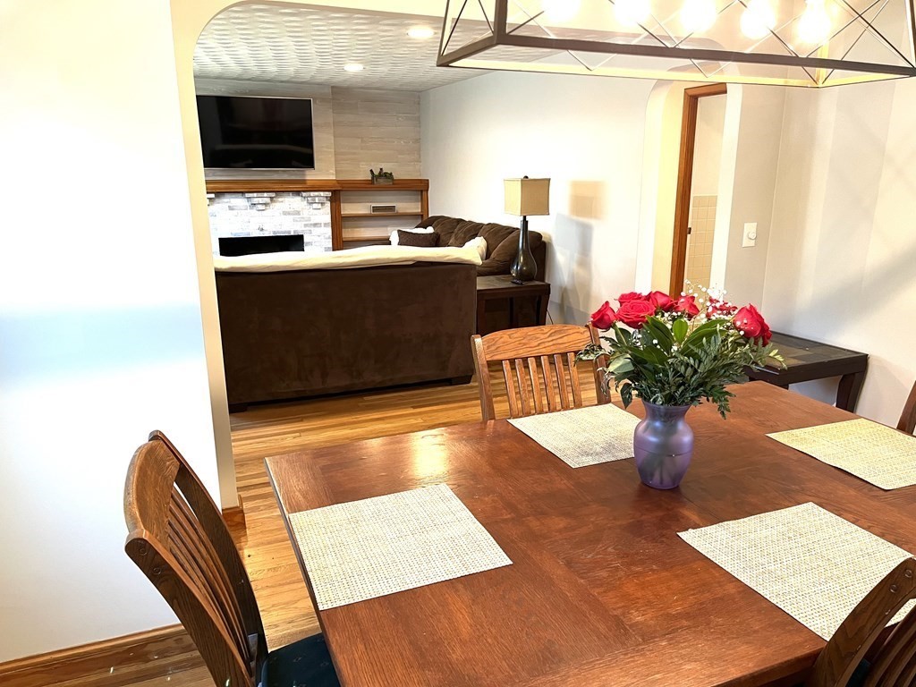 41 Lelland Road Stoughton, MA 02072 - Photo 15 of 29 a living room with stainless steel appliances furniture and a fireplace