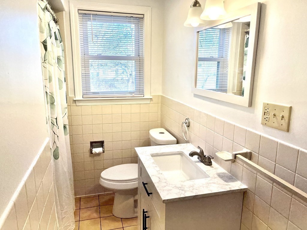 41 Lelland Road Stoughton, MA 02072 - Photo 16 of 29 a bathroom with a sink and a mirror