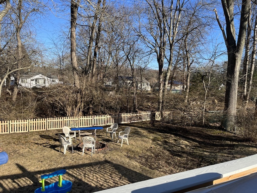 41 Lelland Road Stoughton, MA 02072 - Photo 24 of 29 a view of a roof deck with wooden fence and floor