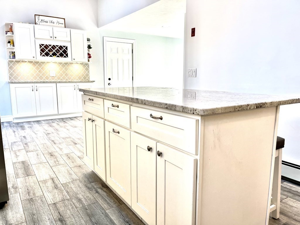 41 Lelland Road Stoughton, MA 02072 - Photo 5 of 29 a view of a kitchen with appliances cabinets and a refrigerator
