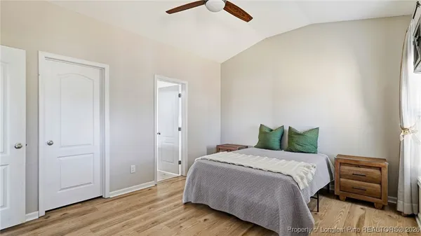 a bedroom with a bed and a dresser