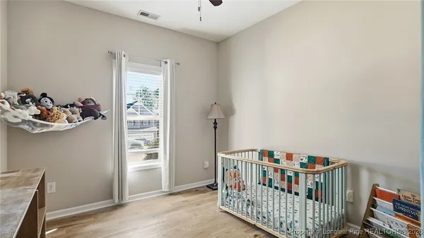 a bedroom with furniture and a window